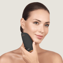 Load image into Gallery viewer, Geske Sonic Thermo Facial Brush 8-in-1 Gray in Use on Face